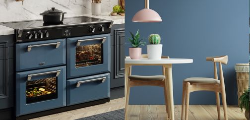 Thunder blue coloured range cooker in a kitchen with a matching blue feature wall